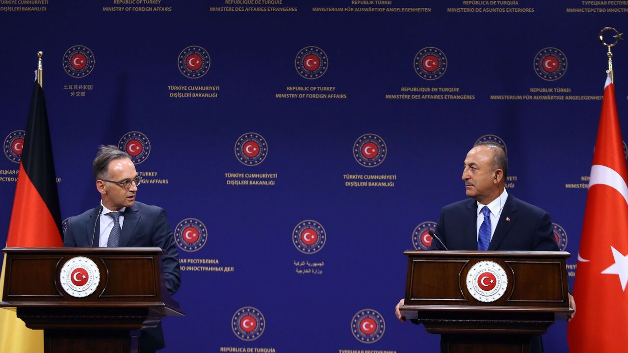 1228199959 Turkish Foreign Affairs Minister Mevlut Cavusoglu (R) and German Foreign Affairs Minister Heiko Maas (L) hold a joint press conference following their meeting at the Turkish Foreign Ministry in Ankara on August 25, 2020. - The German Foreign minister warned on August 25 that Turkey's standoff with Greece in the eastern Mediterranean was at a "very critical" juncture but stressed that both sides appeared ready to talk. A crisis has been brewing in the eastern Mediterranean, where Turkey is at odds with Greec