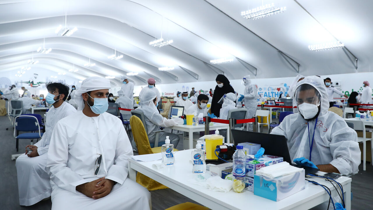 1264999948 ABU DHABI, UNITED ARAB EMIRATES - AUGUST 10: A man waits for his test results after being tested with Laser-based DPI technology at a testing center at the Dubai-Abu Dhabi border on August 10, 2020 in Abu Dhabi, United Arab Emirates. The UAE has recorded around 62,000 cases of covid-19, with 357 deaths, among its population of 9.6 million people. New cases have steadily declined since a spike at the beginning of July. (Photo by Francois Nel/Getty Images)