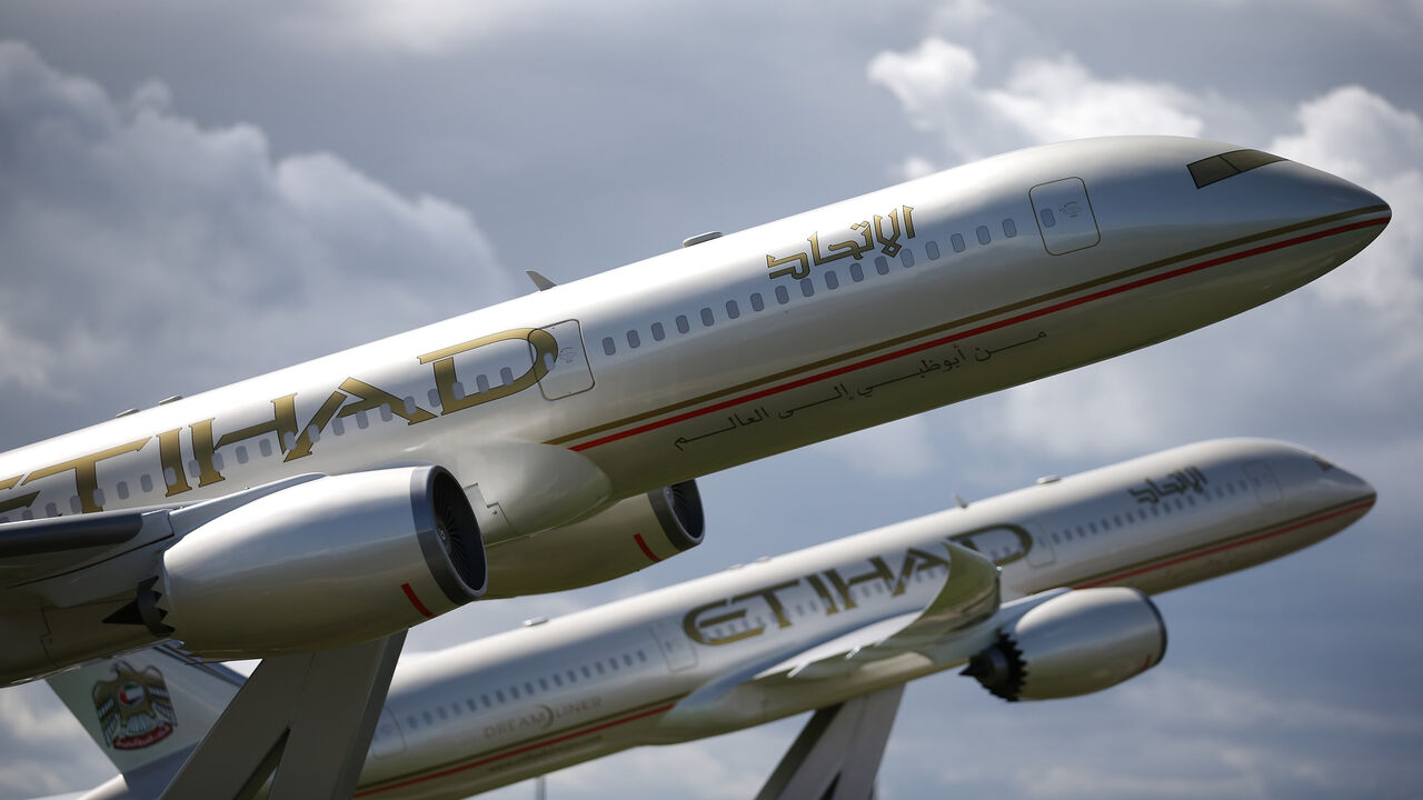 453485894 LONDON, ENGLAND - AUGUST 11: Large scale models of Etihad Boeing 787 Dream Liners are displayed near Terminal Four at Heathrow Airport on August 11, 2014 in London, England. Heathrow is the busiest airport in the United Kingdom and the third busiest in the world. The airport's operator BAA wants to build a third runway to cope with increased demand. (Photo by Peter Macdiarmid/Getty Images)