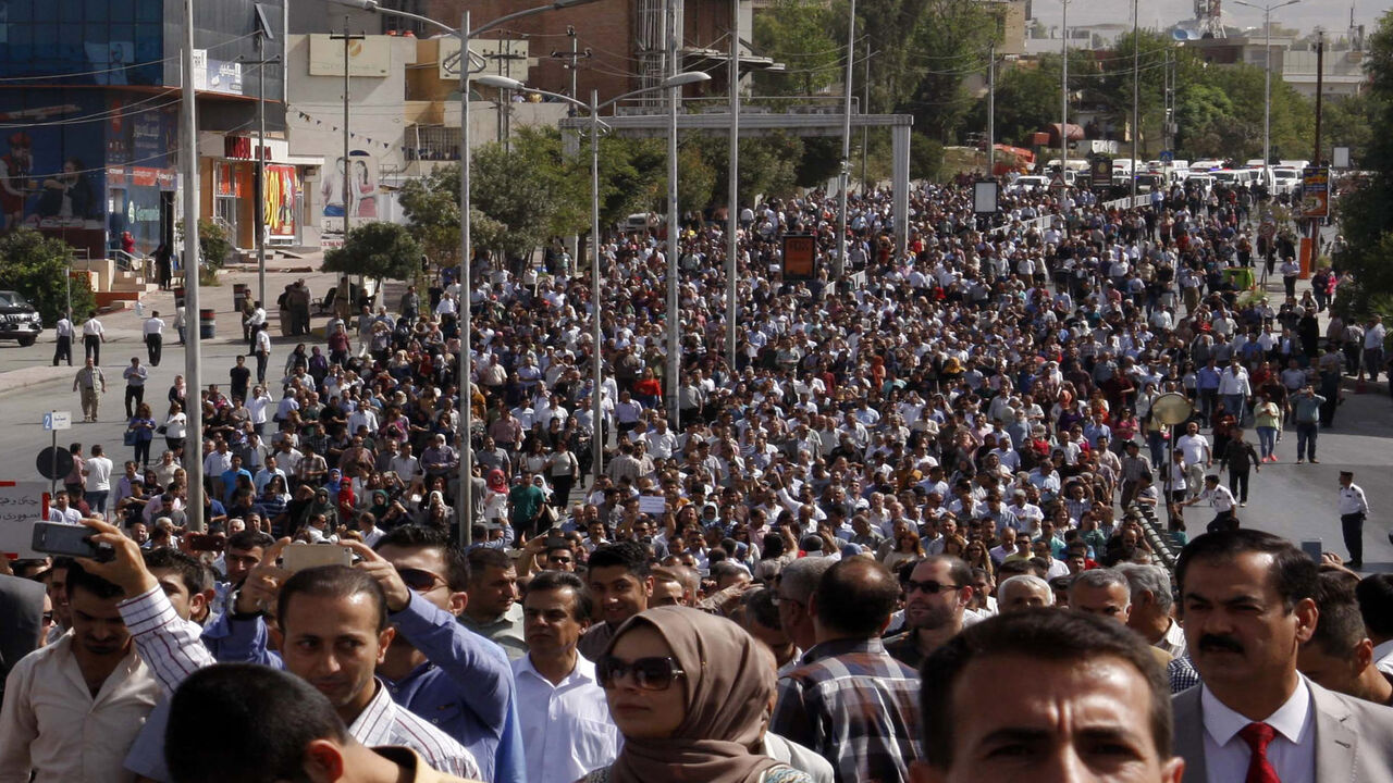 610639188 Iraqi Kurds take part in a mass demonstration in the city of Sulaymaniyah to demand payment of their salaries and an end to corruption, on September 27, 2016. / AFP / SHWAN MOHAMMED (Photo credit should read SHWAN MOHAMMED/AFP via Getty Images)
