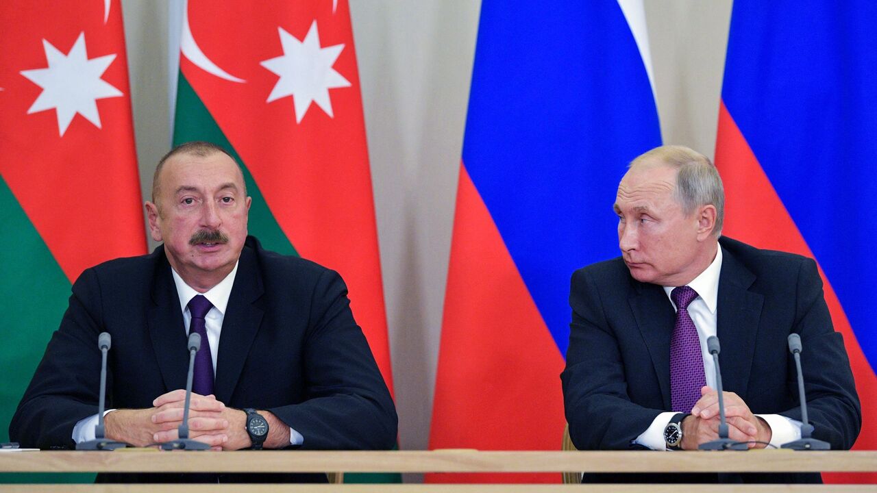 1025777486 Azeri President Ilham Aliyev (L) talks during his meeting with Russian President Vladimir Putin in Sochi on September 1, 2018. (Photo by Alexey DRUZHININ / Sputnik / AFP) (Photo credit should read ALEXEY DRUZHININ/AFP via Getty Images)