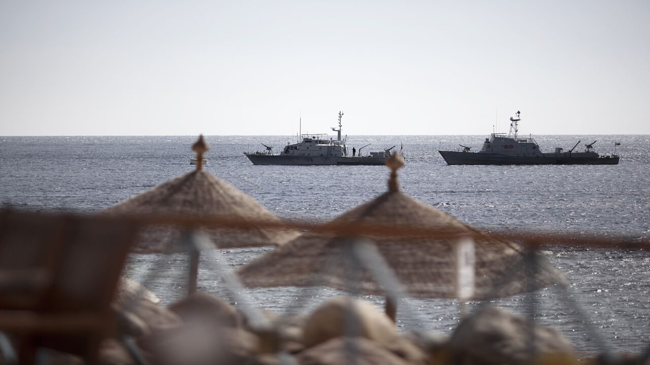109223590 Egyptian navy vessels patrol off the coast of the Red Sea resort city of Sharm el-Sheikh on February 17, 2011. Tourists have started trickling back to Egypt's balmy Red Sea coast in the wake of its national uprising, but ghost-town resorts are still reeling from crises that preceded the unrest. AFP PHOTO/MARCO LONGARI (Photo credit should read MARCO LONGARI/AFP via Getty Images)