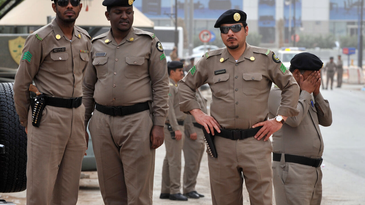 109950807 Saudi policemen stand guard in front of the "Public grievances Department" building in Riyadh on March 11, 2011 as Saudi Arabia launched a massive security operation in a menacing show of force to deter protesters from a planned "Day of Rage" to press for democratic reform in the kingdom. AFP PHOTO/FAYEZ NURELDINE (Photo credit should read FAYEZ NURELDINE/AFP via Getty Images)