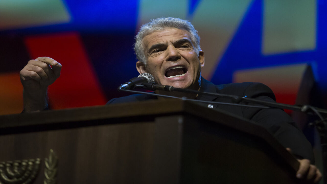 1146325891 TEL AVIV, ISRAEL - MAY 25: Yair Lapid, Blue and White party member speaks at a protest against Netanyahu's 'Immunity Law' on May 25, 2019 in Tel Aviv, Israel. Israeli Prime Minster Benjamin Netanyahu attempt to push for laws that will give him immunity from criminal prosecution as part of the coalition agreements for the next goverment. (Photo by Amir Levy/Getty Images)