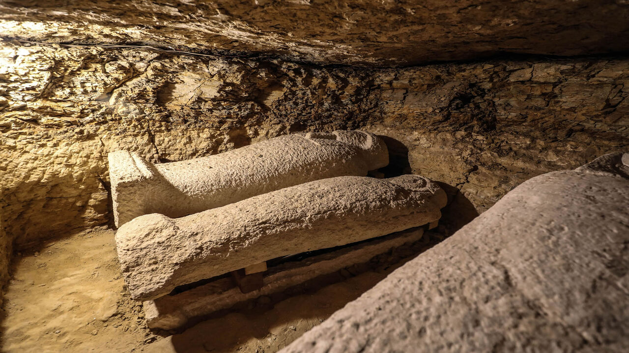 1197622629 A picture taken on January 30, 2020, shows limestone sarcophagi discovered among many archeological finds in 3000-year-old communal tombs dedicated to high priests, in Al-Ghoreifa in Tuna al-Jabal in the Minya governorate. - Egypt's antiquities ministry unveiled 16 tombs of ancient high priests containing 20 sarcophagi, including one dedicated to the sky god Horus, discovered at the archaeological site, about 300 kilometres (186 miles) south of Cairo. The shared tombs were dedicated to high priests of the g