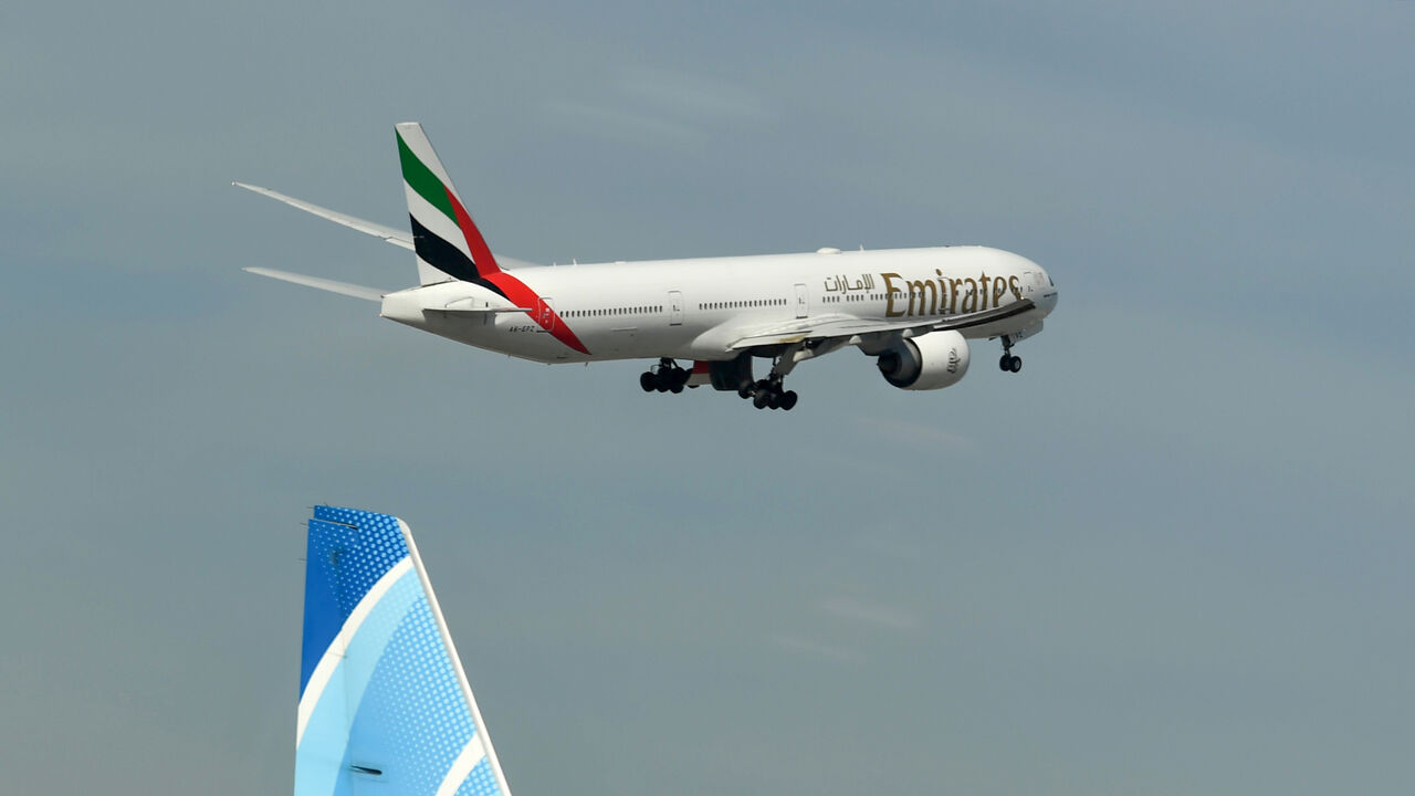1209267911 An Emirates Boeing 777-31H aircraft takes off from Dubai International Airport on April 6, 2020, as Emirates Airline resumed a limited number of outbound passenger flights after its COVID-19 coronavirus-enforced stoppage. (Photo by KARIM SAHIB / AFP) (Photo by KARIM SAHIB/AFP via Getty Images)