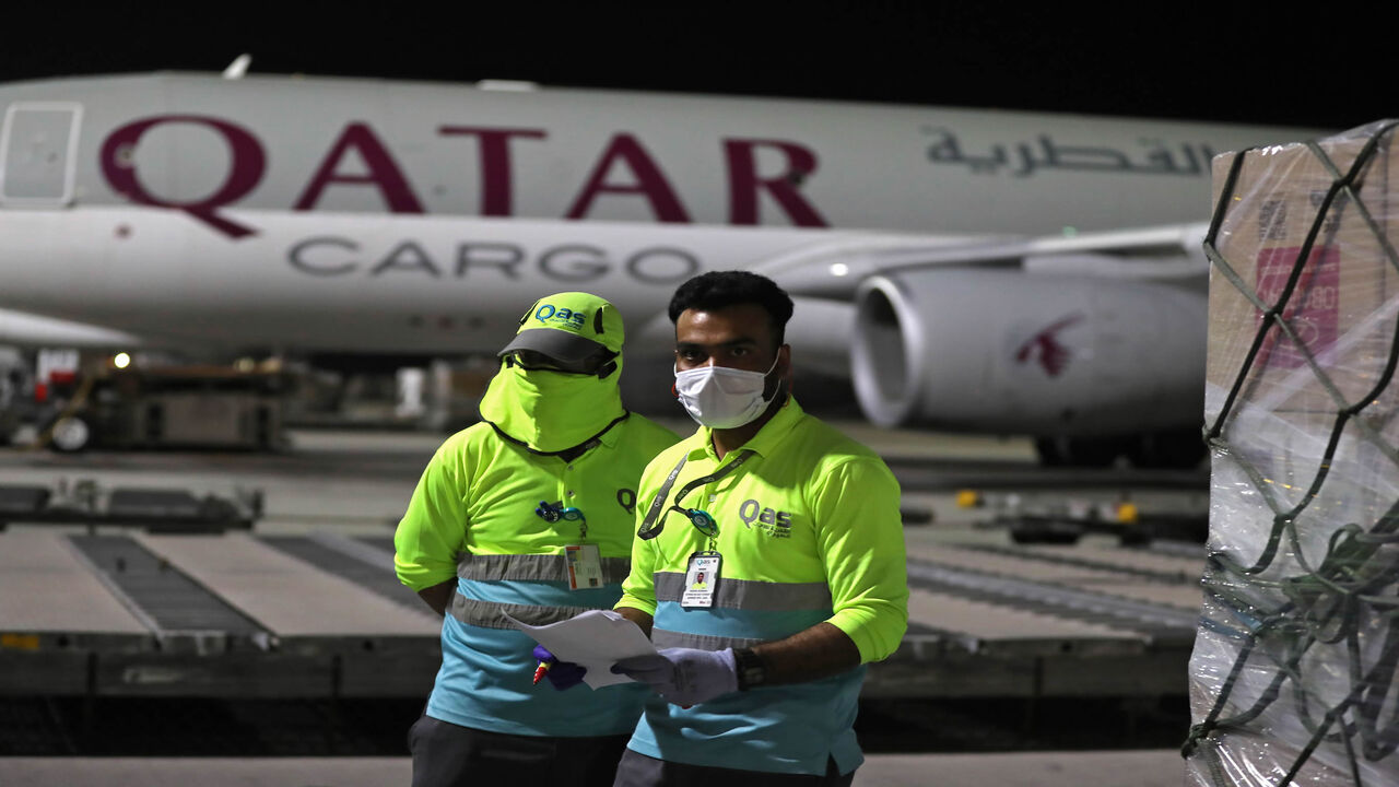 1211254124 Supplies to tackle the coronavirus COVID-19 pandemic donated by the Qatar Fund for Development are loaded onto a Qatar Airways flight to Kigali in Rwanda at Doha's Hamad International Airport, on April 28, 2020. (Photo by KARIM JAAFAR / AFP) (Photo by KARIM JAAFAR/AFP via Getty Images)
