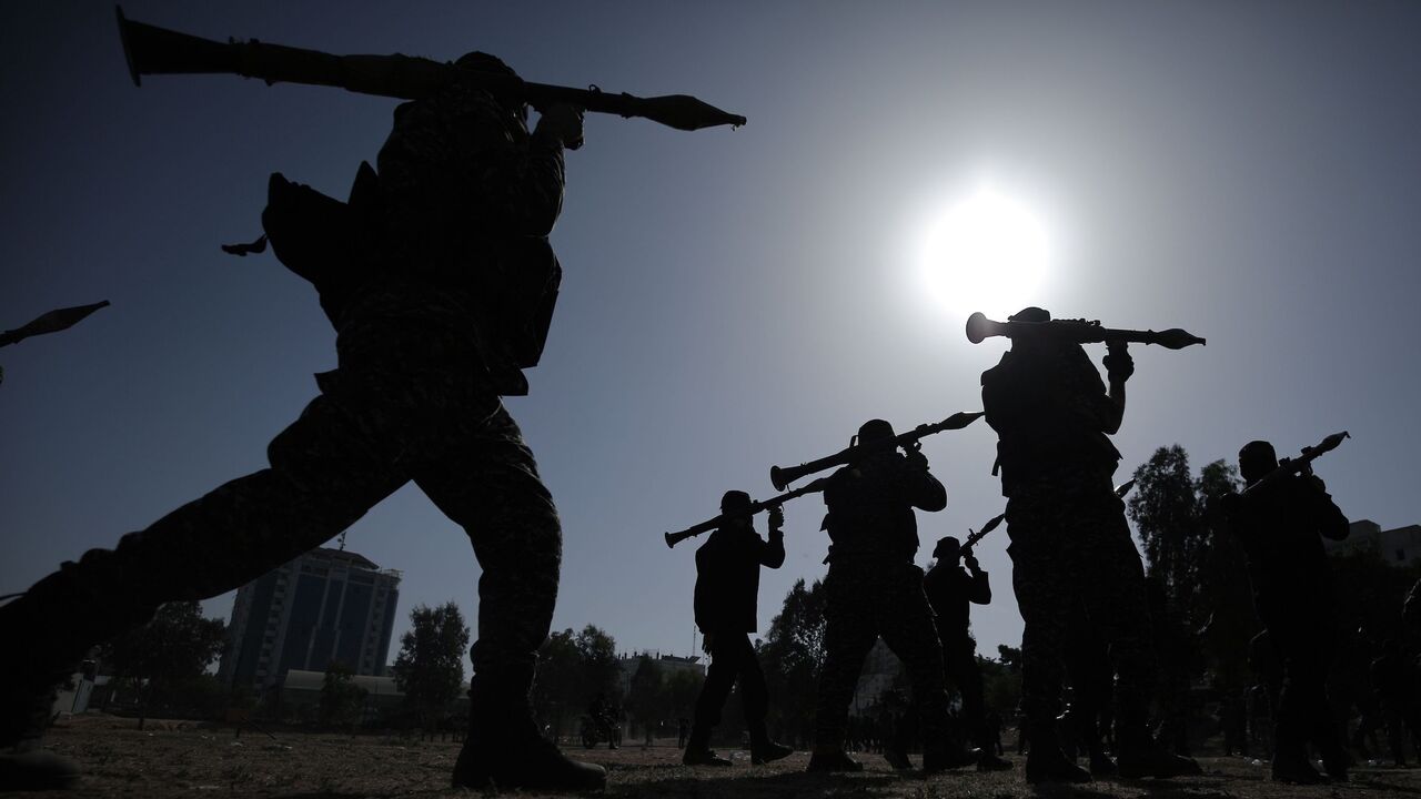 1218461433 TOPSHOT - Members of the Palestinian Islamic Jihad militant group take part in a military parade during a condolences ceremony for the movement's former leader Ramadan Shalah in Gaza city, on June 8, 2020, two days after his death in neighbouring Lebanon. - The 62-year-old was buried in Syria on June 7, a day following his death after a long illness. (Photo by Mohammed ABED / AFP) (Photo by MOHAMMED ABED/AFP via Getty Images)