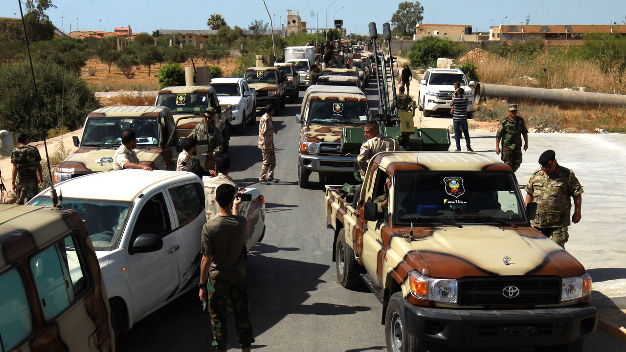 1221007957 Members of the self-proclaimed eastern Libyan National Army (LNA) special forces gather in the city of Benghazi, on their way to reportedly back up fellow LNA fighters on the frontline west of the city of Sirte, facing forces loyal to the UN-recognised Government of National Accord (GNA), on June 18, 2020. - The resurgent GNA has vowed to push on for Sirte, late Libyan leader Moamer Kadhafi's hometown and the last major settlement before the traditional boundary between western Libya and strongman Khalifa H