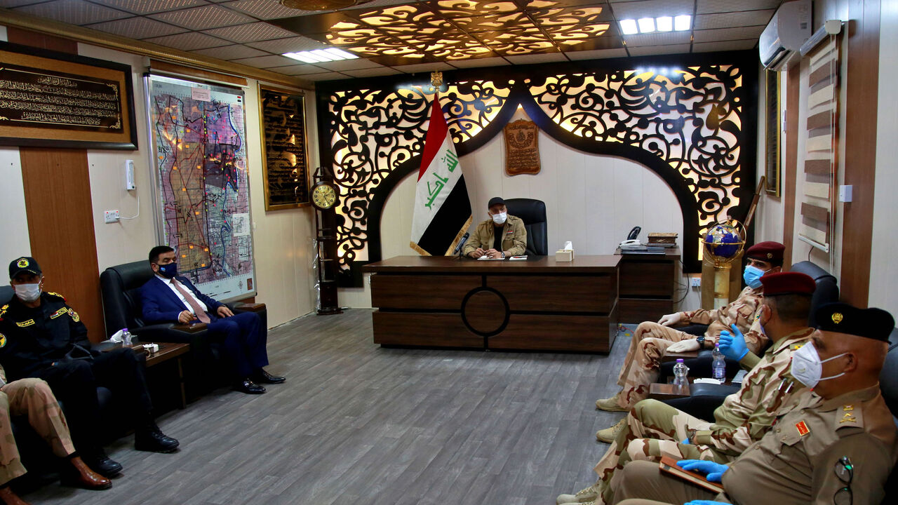 1227709116 Iraqi Prime Minister Mustafa al-Kadhemi (C) chairs a meeting with military commanders in Tarmiyah, 35 kilometres (20 miles) north of Baghdad on July 20, 2020. (Photo by Khalid MOHAMMED / POOL / AFP) (Photo by KHALID MOHAMMED/POOL/AFP via Getty Images)