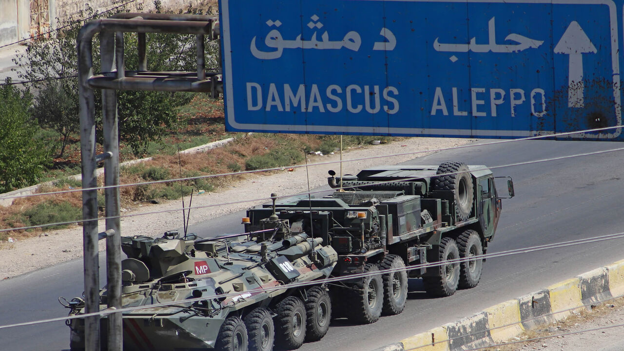 1228192193 A Turkish-Russian military convoy tows a damaged vehicle after its joint patrol was reportedly targeted on the strategic M4 highway, near the Syrian town of Urum al-Jawz in the south of the northwestern Idlib province, on August 25, 2020. - Russia and Turkey launched joint patrols along the M4 highway in March following a ceasefire agreement aimed at stopping heavy fighting in and around Idlib, the last major bastion of anti-government forces in Syria's civil war. (Photo by Abdulaziz KETAZ / AFP) (Photo by
