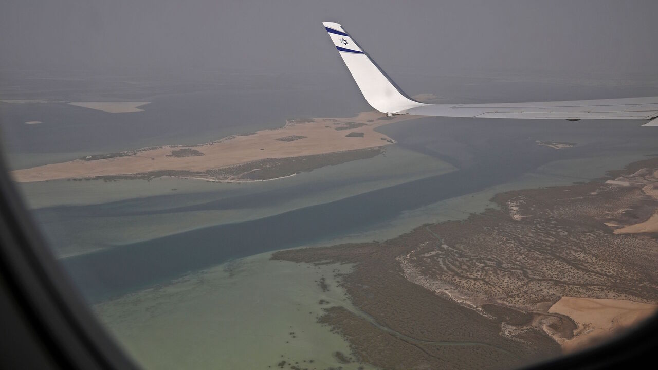 1228282981 A picture taken on August 31, 2020, shows a view from the window of the the El Al's flight LY971, which will carry the delegation from Tel Aviv to Abu Dhabi, ahead of landing at the Abu Dhabi airport. - A US-Israeli delegation including White House advisor Jared Kushner took off on a historic first direct commercial flight from Tel Aviv to Abu Dhabi to mark the normalisation of ties between the Jewish state and the UAE. (Photo by NIR ELIAS / POOL / AFP) (Photo by NIR ELIAS/POOL/AFP via Getty Images)