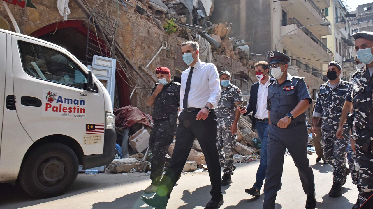 1228283083 Lebanon's newly-appointed Prime Minister Mustapha Adib (C) visits Beirut's badly-hit Gemmayzeh neighbourhood, on August 31, 2020. - Lebanon's under-fire political leaders designated a new prime minister, the diplomat Mustapha Adib, to tackle the country's deep political and economic crisis, hours before French President Emmanuel Macron was due to visit. (Photo by - / AFP) (Photo by -/AFP via Getty Images)