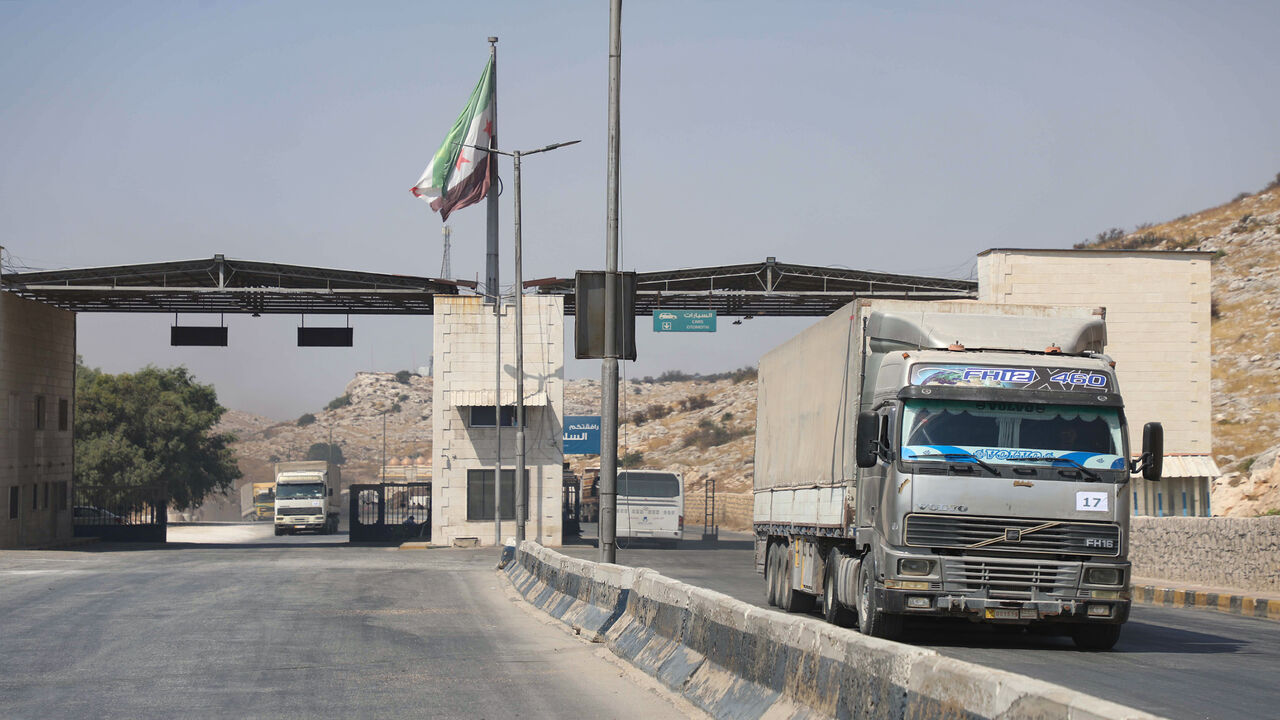 1228385243 International humanitarian aid trucks cross into Syria's northwestern Idlib province through the Bab al-Hawa border crossing with Turkey, on September 7, 2020. (Photo by AAREF WATAD / AFP) (Photo by AAREF WATAD/AFP via Getty Images)