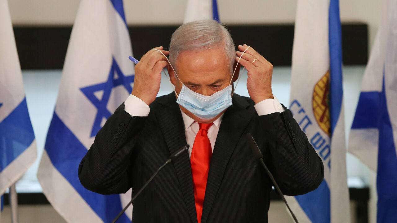 1228406304 Israeli Prime Minister Benjamin Netanyahu during his visit to the Israeli city of Beit Shemesh near Jerusalem on September 8, 2020. - Once a role model in the fight against Covid-19, Israel decided to partially lock down several cities to slow the fast-spreading contagion as the government faces harsh criticism over the crisis. The government's ministerial committee on coronavirus decided to impose "a nightly closure" on 40 cities and towns with the highest infection rates, Prime Minister Benjamin Netanyahu