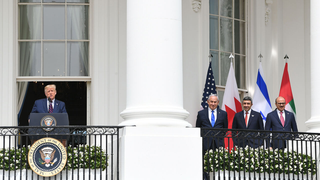 1228529253 TOPSHOT - (L-R)US President Donald Trump speaks as Israeli Prime Minister Benjamin Netanyahu,UAE Foreign Minister Abdullah bin Zayed Al-Nahyan and Bahrain Foreign Minister Abdullatif al-Zayani listen before they participate in the signing of the Abraham Accords where the countries of Bahrain and the United Arab Emirates recognize Israel, on the South Lawn of the White House in Washington, DC, September 15, 2020. - Israeli Prime Minister Benjamin Netanyahu and the foreign ministers of Bahrain and the United
