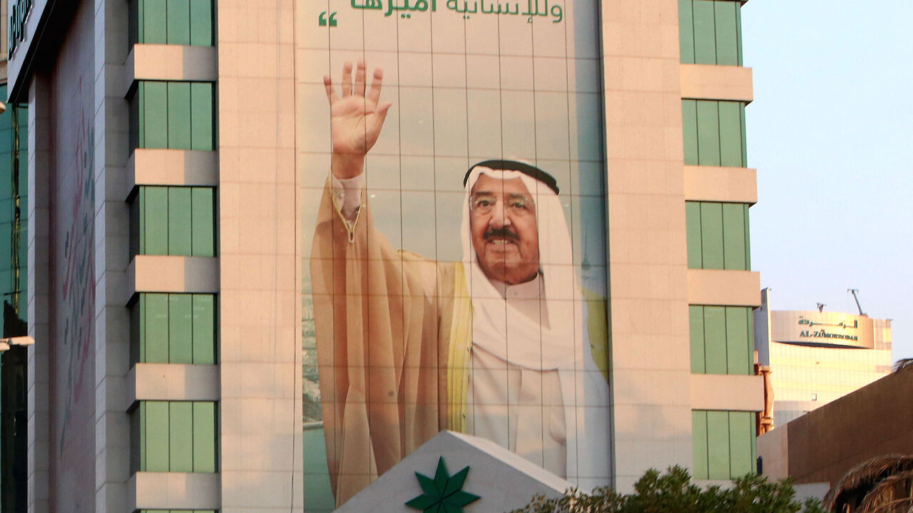 1228785869 A picture taken on September 29, 2020 in Kuwait City shows a portrait of Kuwait's emir, Sheikh Sabah Al-Ahmad Al-Sabah. - Sheikh Sabah Al-Ahmad Al-Sabah, regarded as the architect of the nation's modern foreign policy, died today at the age of 91, according to the royal court. (Photo by Yasser Al-Zayyat / AFP) (Photo by YASSER AL-ZAYYAT/AFP via Getty Images)