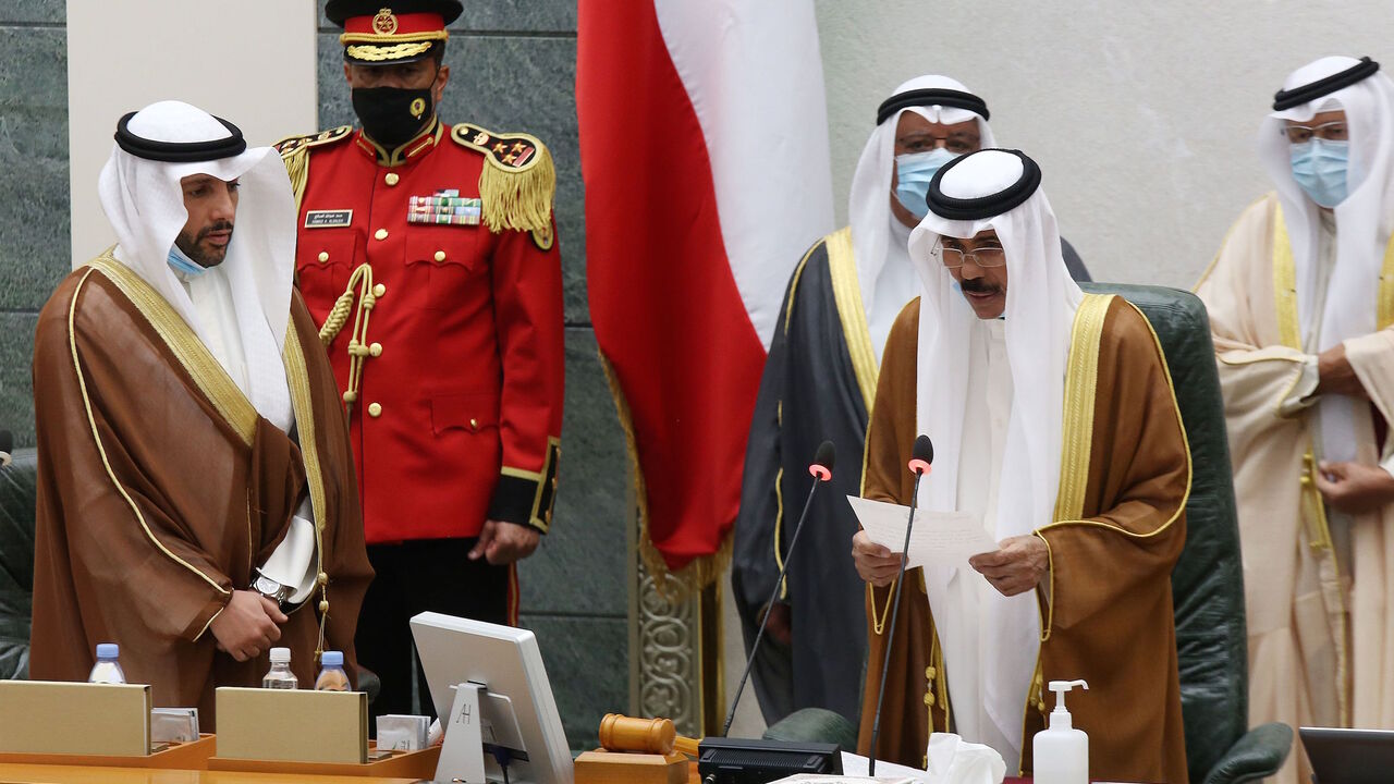 1228799339 Sheikh Nawaf al-Ahmad Al-Sabah (2-R) reads a statement asfter being sworn in as Kuwait's new Emir at the National Assembly in Kuwait City, as Parilament Speaker Marzouq al-Ghanem (L) looks on, on September 30, 2020. - Kuwait today swore in its new emir, Sheikh Nawaf al-Ahmad Al-Sabah, after the death of his half-brother, Sheikh Sabah, who died in the US at the age of 91. (Photo by Yasser Al-Zayyat / AFP) (Photo by YASSER AL-ZAYYAT/AFP via Getty Images)