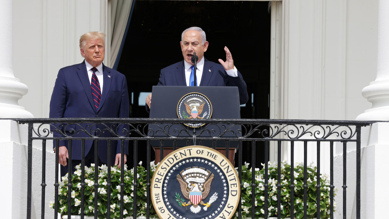 1272636720 WASHINGTON, DC - SEPTEMBER 15: Prime Minister of Israel Benjamin Netanyahu speaks as U.S. President Donald Trump looks on during the signing ceremony of the Abraham Accords on the South Lawn of the White House September 15, 2020 in Washington, DC. Witnessed by President Trump, Prime Minister Netanyahu signed a peace deal with the UAE and a declaration of intent to make peace with Bahrain. (Photo by Alex Wong/Getty Images)