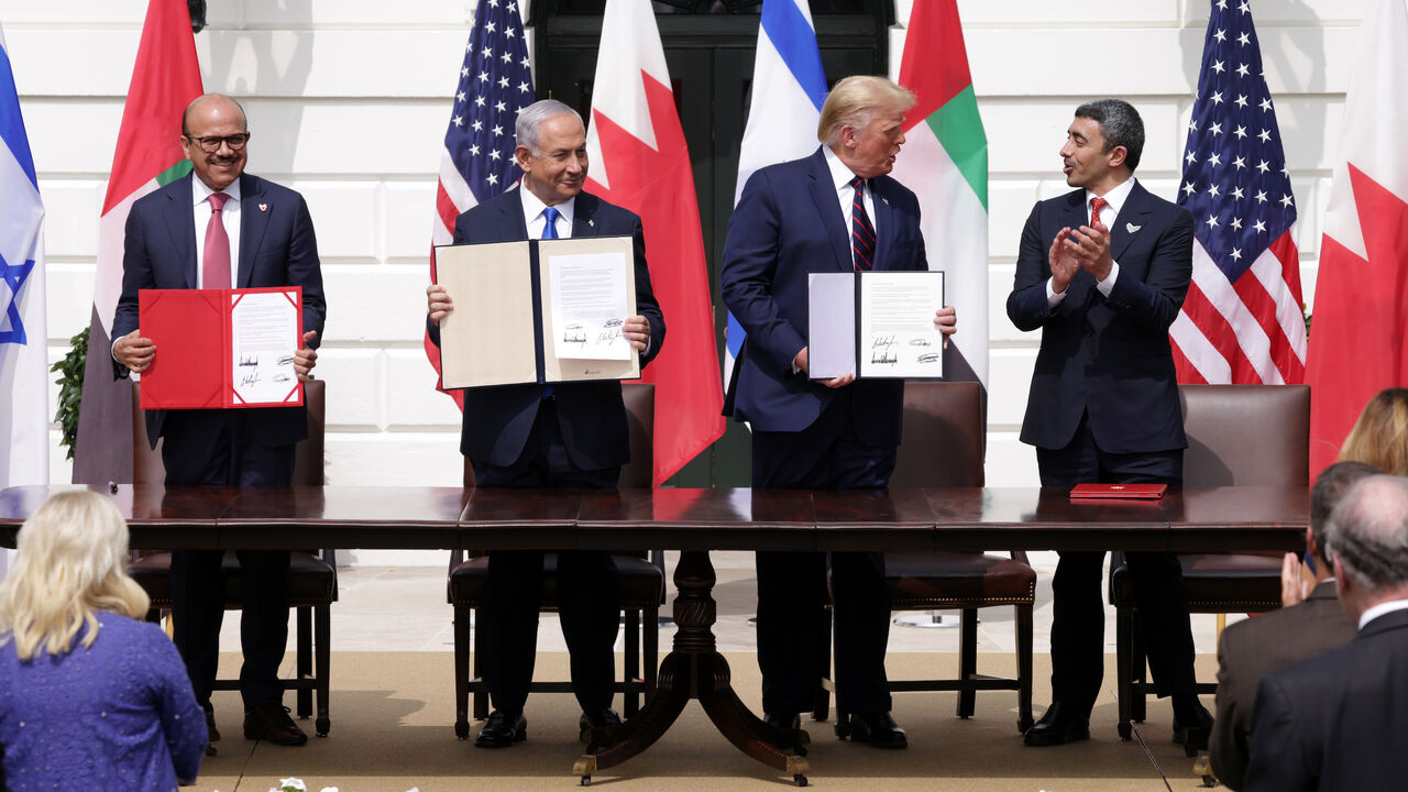 1272666091 WASHINGTON, DC - SEPTEMBER 15: (L-R) Foreign Affairs Minister of Bahrain Abdullatif bin Rashid Al Zayani, Prime Minister of Israel Benjamin Netanyahu, U.S. President Donald Trump, and Foreign Affairs Minister of the United Arab Emirates Abdullah bin Zayed bin Sultan Al Nahyan participate in the signing ceremony of the Abraham Accords on the South Lawn of the White House on September 15, 2020 in Washington, DC. Witnessed by President Trump, Prime Minister Netanyahu signed a peace deal with the UAE and a decl
