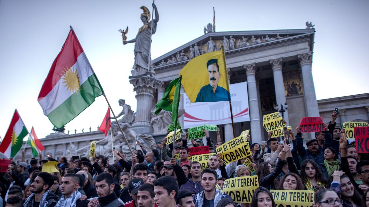 457000924 Pro Kurdish supporters march by Austrian Parliament as approximately 2000 thousand people attended a protest in Vienna on October 10, 2014 to show solidarity for Syrian Kurds who are fighting to defend the Syrian-Turkey border town of Kobane from Islamic State (Isis) militants. AFP PHOTO / JOE KLAMAR (Photo credit should read JOE KLAMAR/AFP via Getty Images)