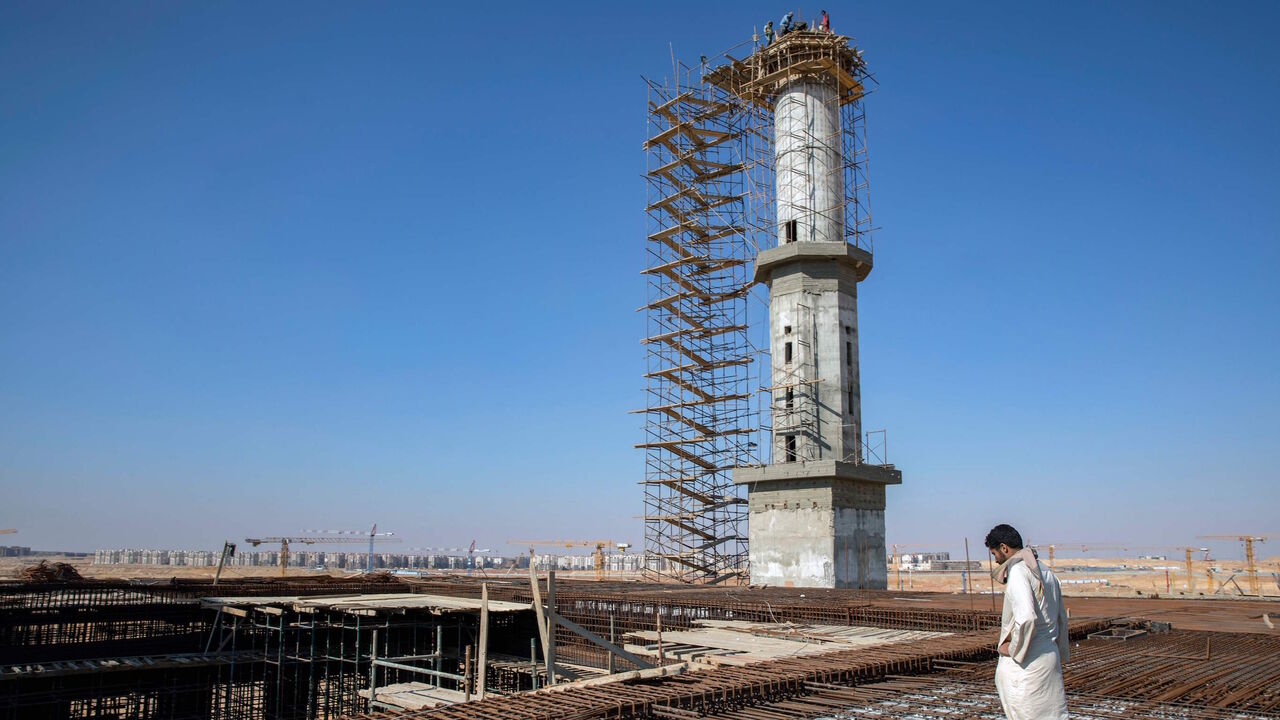 1142523700 A bricklayer is working on a mosque construction site, it the new administrative capital, some 50 km east of the capital Cairo, on March 8, 2019 (Photo by PEDRO COSTA GOMES / AFP) (Photo by PEDRO COSTA GOMES/AFP via Getty Images)