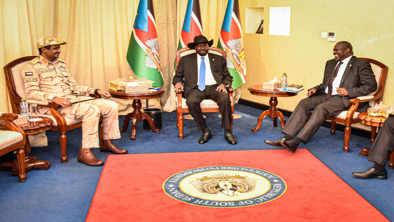 1189037815 South Sudanese President Salva Kiir (C), South Sudan's opposition leader Riek Machar (R) and Sudan's deputy head of the Transitional Military Council Mohamed Hamdan Daglo "Hemeti" sit after their peace agreement meeting at the State House in Juba, South Sudan, on December 16, 2019. (Photo by Majak Kuany / AFP) (Photo by MAJAK KUANY/AFP via Getty Images)