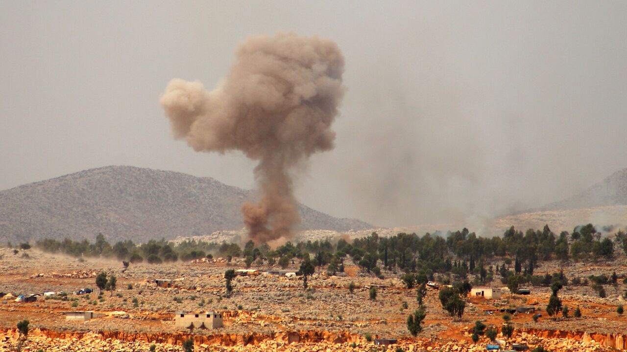 1228450679 Smoke billows from a reported Russian airstrike near the village of Hafsarjah, in the western countryside of Idlib province in northwestern Syria, on September 11, 2020. (Photo by Abdulaziz KETAZ / AFP) (Photo by ABDULAZIZ KETAZ/AFP via Getty Images)