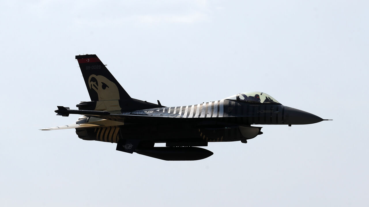 1228493716 An acrobatic plane pilot performs with General Dynamics F-16 Solo Turk aerial aerobatic aircraft during the 5th Sivrihisar Airshow in Sivrihisar district of Eskisehir, in Turkey, on September 13, 2020. (Photo by Adem ALTAN / AFP) (Photo by ADEM ALTAN/AFP via Getty Images)