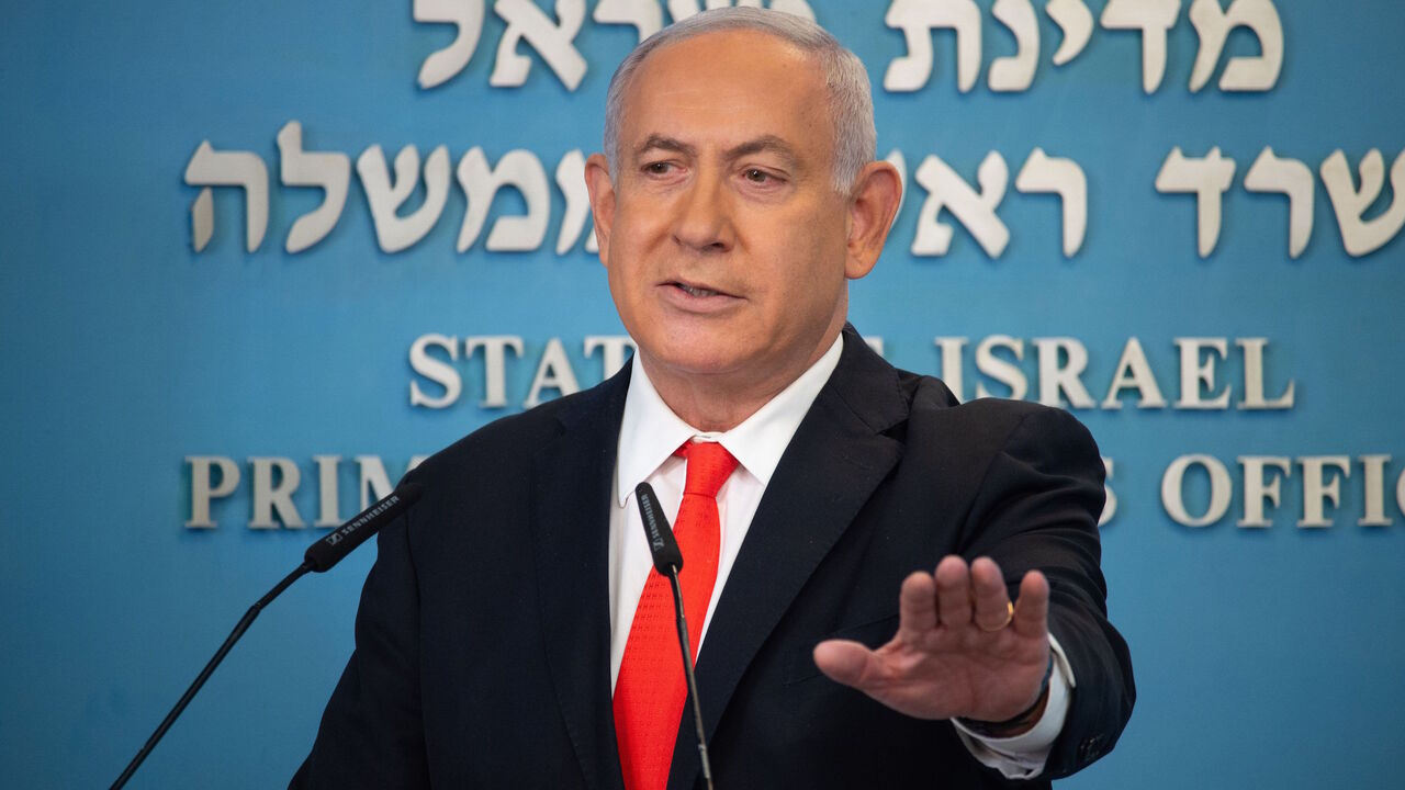 1228498417 Israeli Prime Minister Benjamin Netanyahu gives a briefing on coronavirus developments in Israel at his office in Jerusalem, on September 13, 2020. - Israel's government announced it would impose a three-week nationwide lockdown in an effort to stem one of the world's highest novel coronavirus infection rates after a surge in cases. (Photo by Yoav Dudkevitch / POOL / AFP) (Photo by YOAV DUDKEVITCH/POOL/AFP via Getty Images)