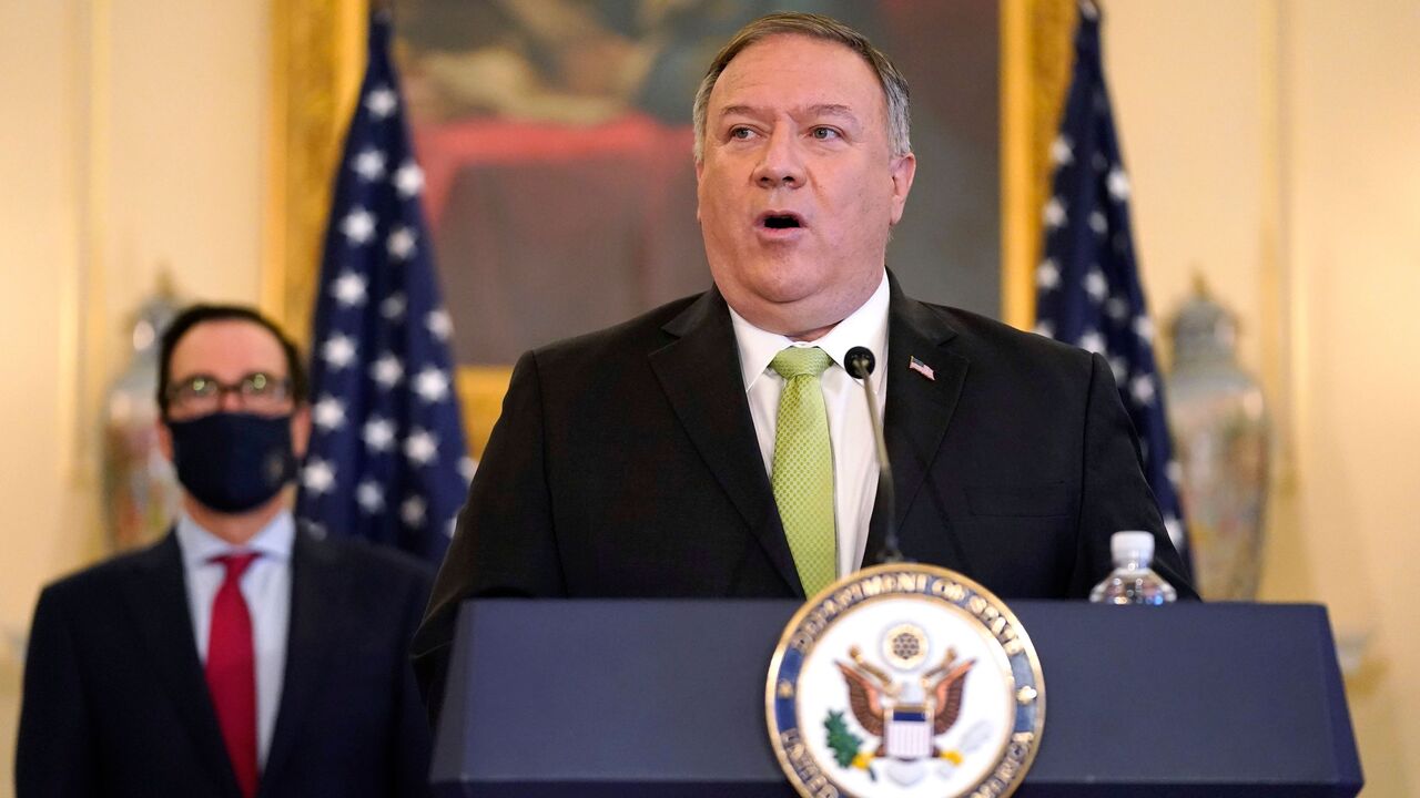 1228638605 US Secretary of State Mike Pompeo speaks during a news conference to announce the Trump administration's restoration of sanctions on Iran, on September 21, 2020, at the US State Department in Washington,DC, as US Treasury Secretary Steve Mnuchin looks on. - The United States said Monday it was imposing sanctions on Iran's defense ministry and Venezuelan President Nicolas Maduro under a UN authority which is widely contested. "For nearly two years corrupt officials in Tehran have worked with the illegitimate