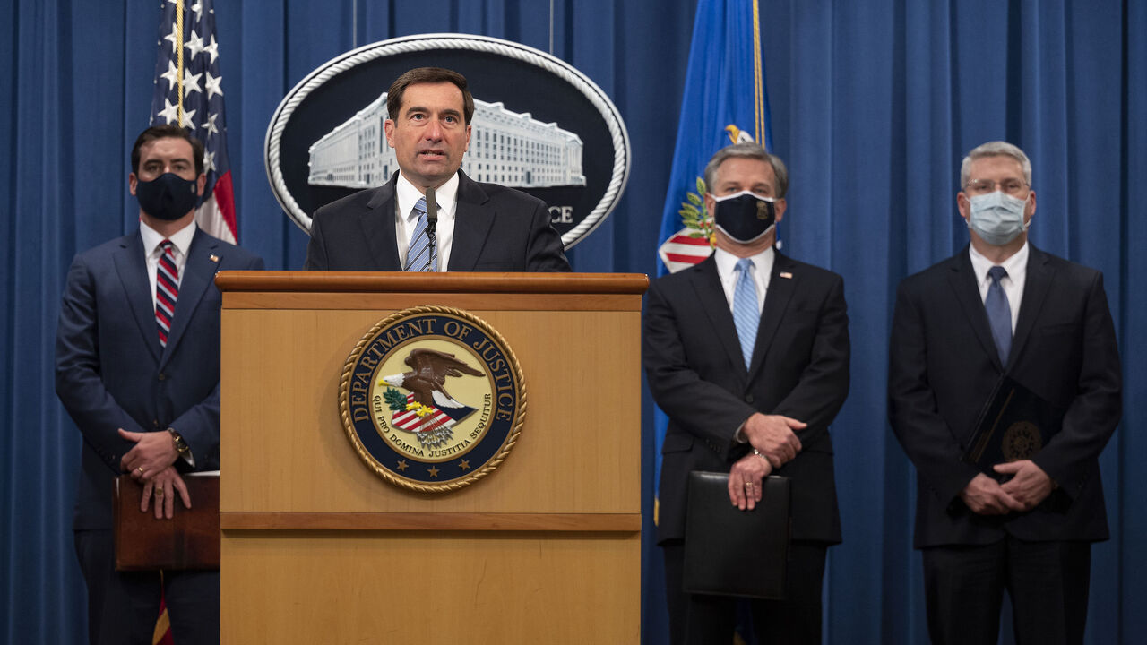 1228939878 Assistant Attorney General John C. Demers(C) of the National Security Division, FBI Director Christopher Wray(2ndR),US Attorney for the Eastern District of Virginia G. Zachary Terwilliger(L) and Acting Assistant Director in Charge of the FBI Washington Field Office James A. Dawson(R) host a press conference on a national security matter at the Department of Justice in Washington, DC, on October 7, 2020. - Two members of an Islamic State cell dubbed the "Beatles" accused of killing several Western hostages a