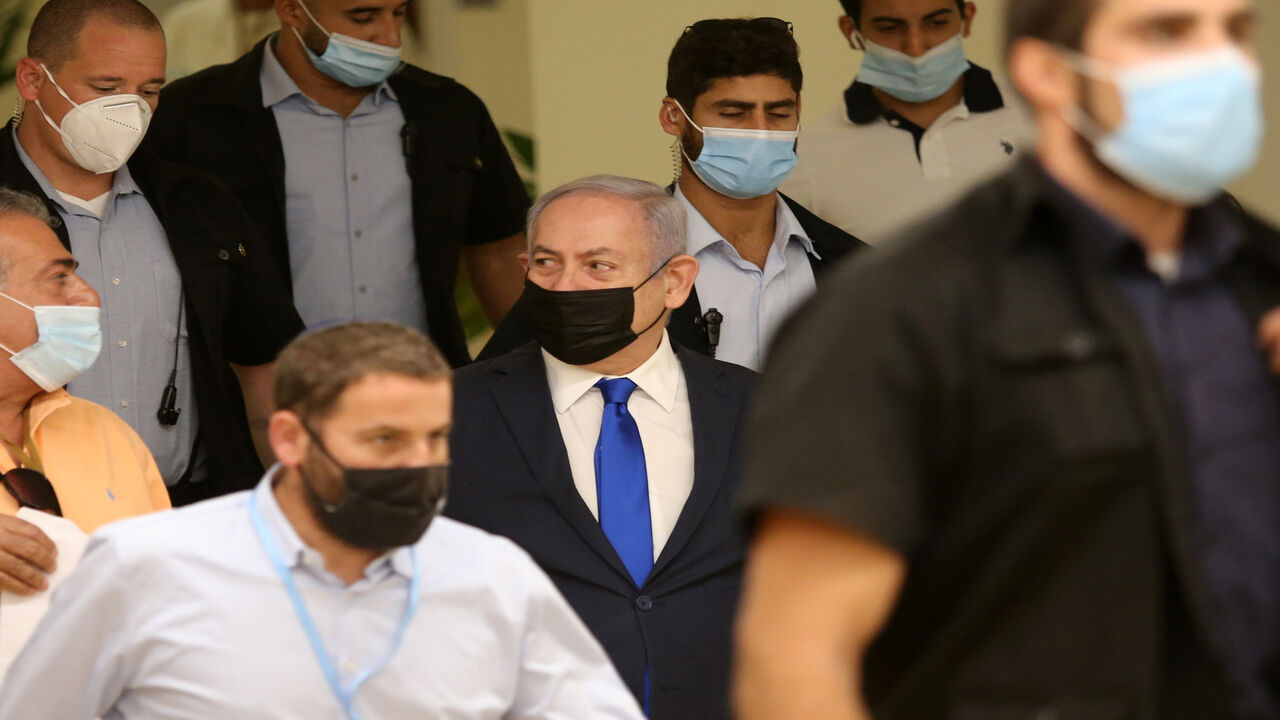 1229083087 Israeli Prime Minister Benjamin Netanyahu (C) arrives to attend a meeting at the Knesset (Parliament) in Jerusalem on October 15, 2020. (Photo by Alex KOLOMIENSKY / POOL / AFP) (Photo by ALEX KOLOMIENSKY/POOL/AFP via Getty Images)