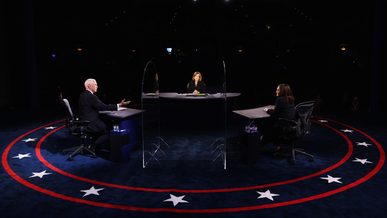 1279066205 SALT LAKE CITY, UTAH - OCTOBER 07: Democratic vice presidential nominee Sen. Kamala Harris (D-CA) and U.S. Vice President Mike Pence participate in the vice presidential debate moderated by Washington Bureau Chief for USA Today Susan Page (C) at the University of Utah on October 7, 2020 in Salt Lake City, Utah. The vice presidential candidates only meet once to debate before the general election on November 3. (Photo by Justin Sullivan/Getty Images)