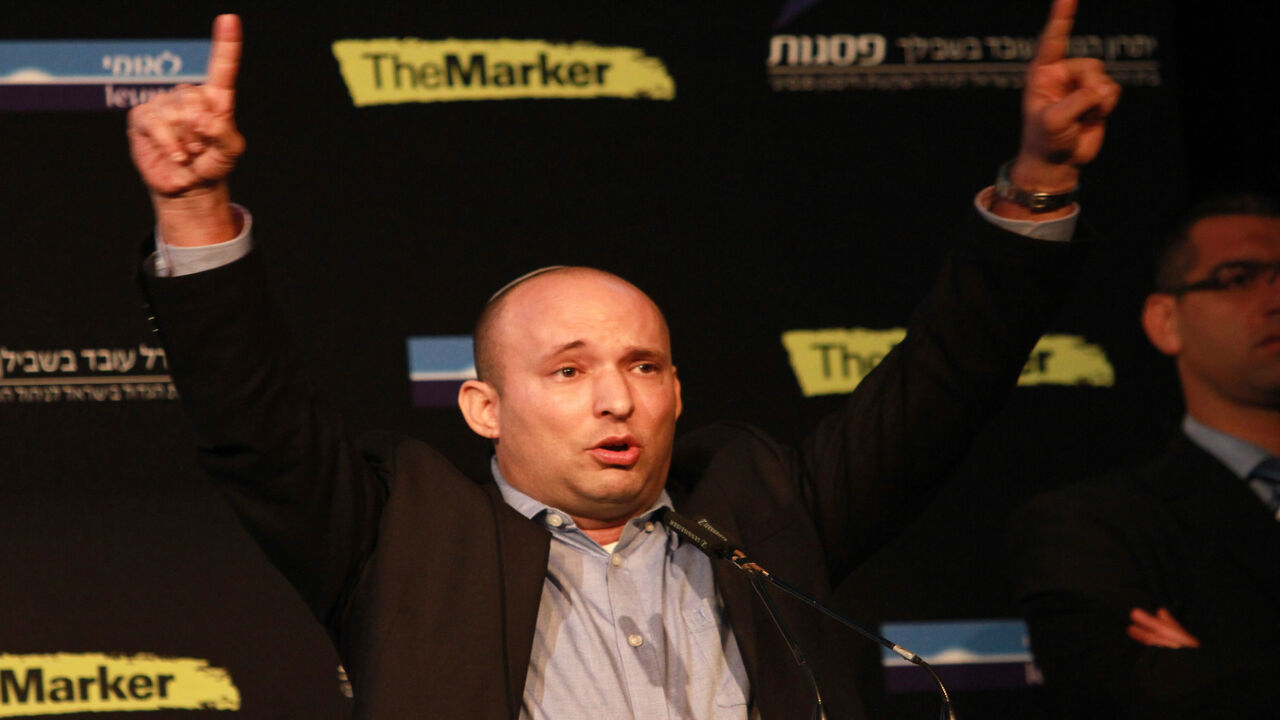 465838816 Israeli Economy Minister and head of the far-right Jewish Home party, Naftali Bennett gestures as he gives a speech during a debate on economy on March 11, 2015 in the costal Israeli city of Tel Aviv. Six days before Israel votes in a snap general election, the centre-left Zionist Union opened a lead of several points over the ruling rightwing Likud party, a poll showed. Bennett, 42, is a champion of the settler movement and a key challenger of Netanyahu to head Israel's rightwing. AFP PHOTO / GIL COHEN-
