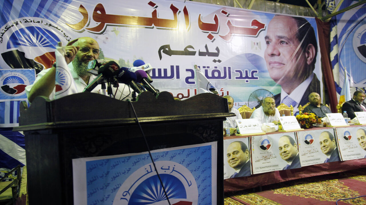 492516849 Members of the Islamist al-Nuor party hold a public conference in support of ex-army chief and presidential candidate Abdel-Fattah Al-Sisi (portrait) in Egypt's northern port city of Alexandria on May 20, 2014. Egypt's Salafist party al-Nour is securing its place on the political scene but loosing supporters by backing Sisi who has launched a crackdown on their former Islamist allies the Muslim Brotherhood. AFP PHOTO / AHMED ARAB / AFP PHOTO / - (Photo credit should read -/AFP via Getty Images)