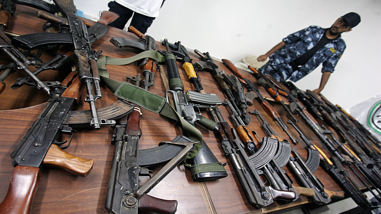 76136139 GAZA CITY, GAZA STRIP - AUGUST 16: Members of the Palestinian police force of the Islamic group Hamas display automatic rifles allegedly seized from the Doghmush clan August 16, 2007 in Gaza City, Gaza. The Doghmush clan, linked along with the Army of Islam to the kidnapping of British journalist Alan Johnson, was involved in gun battles on August 14 that left two Hamas police officers dead. (Photo by Abid Katib/Getty Images)