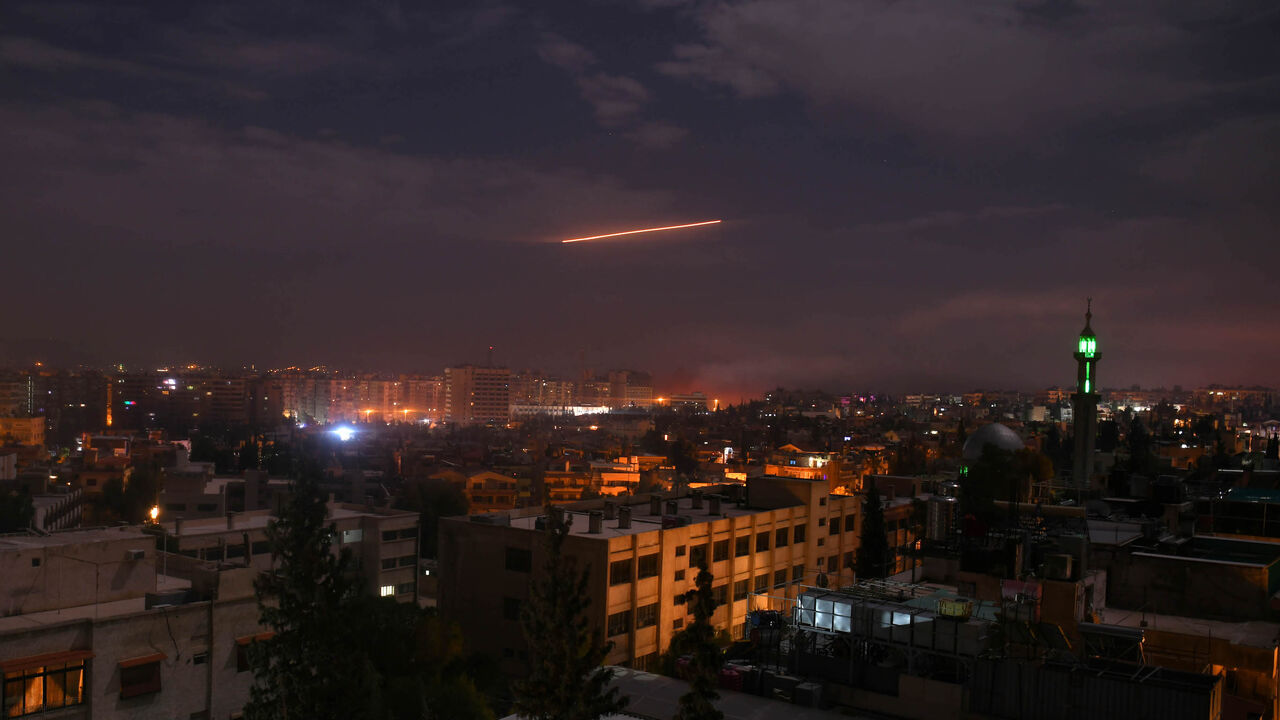 1085741702 A picture taken early on January 21, 2019 shows Syrian air defence batteries responding to what the Syrian state media said were Israeli missiles targeting Damascus. - Israel struck what it said were Iranian targets in Syria today in response to rocket fire it blamed on Iran, sparking concerns of an escalation after a monitor reported 11 fighters killed. Israel openly claimed responsibility for the strikes against facilities it said belonged to the Iranian Revolutionary Guards' Quds Force, continuing its re