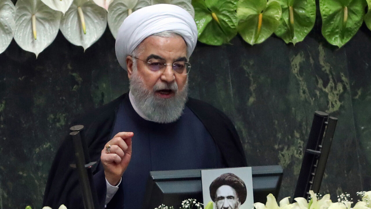 1215439564 Iranian President Hassan Rouhani delivers a speech during the inaugural session of the new parliament following February elections, in Tehran on May 27, 2020. - The 11th legislature since the Islamic revolution of 1979 opened as the country's economy, which has been hard hit by the novel coronavirus, gradually returns to normal. Rouhani, who is in the final year of his second and final term, called on MPs, collectively and individually, to place the "national interest above special interests", "party intere