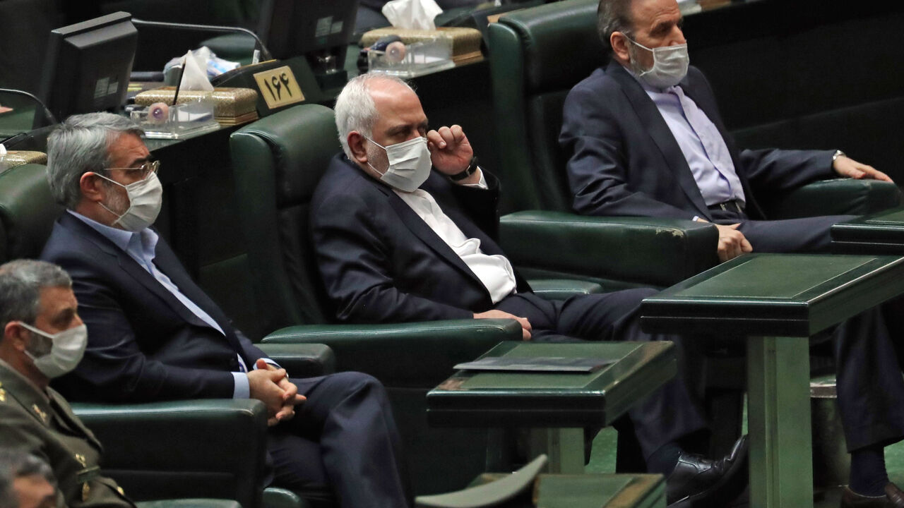 1215439743 Iranian Foreign Minister Mohmmad Javad Zarif (C) attends during the inaugural session of the new parliament in Tehran on May 27, 2020, following February elections. - The 11th legislature since the Islamic revolution of 1979 opened as the country's economy, which has been hard hit by the novel coronavirus, gradually returns to normal. Rouhani, who is in the final year of his second and final term, called on MPs, collectively and individually, to place the "national interest above special interests", "party