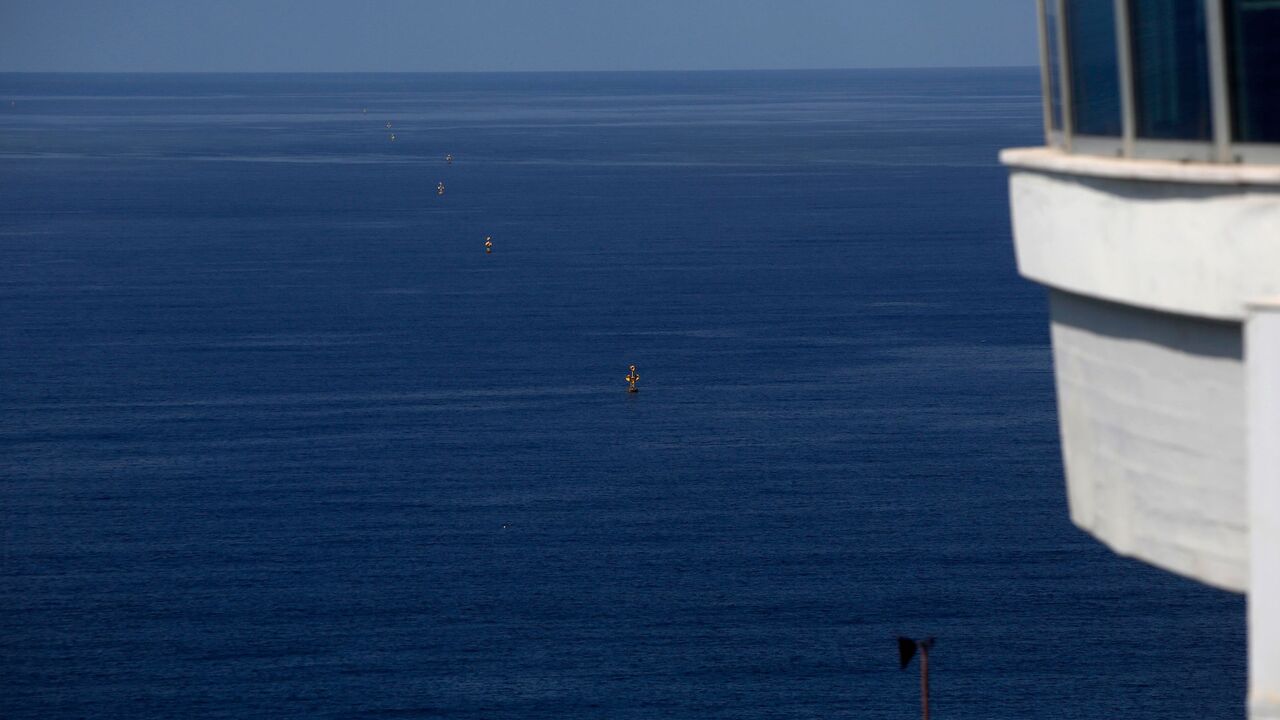 1229025724 A picture taken on October 12, 2020, shows maritime border markers near the Rosh Hanikra Crossing, also known as the Ras Al Naqoura Crossing, between Israel and Lebanon. - On October 1, Lebanon and Israel, which are still technically at war, said they had agreed to begin UN-brokered negotiations over the shared frontier, in what Washington hailed a "historic" agreement, with a tentative date set for the discussions for October 14, which would be confirmed, according to a US envoy. (Photo by JALAA MAREY / AF