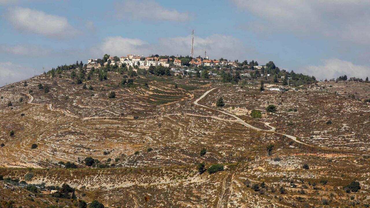 1229061192 A picture taken on October 14, 2020 shows a general view of the Israeli settlement of Psagot on the eastern outskirts of Ramallah in the occupied West Bank. - Israel approved 2,166 new homes in settlements across the occupied West Bank, official figures sent to AFP showed, ending an eight-month lull in settlement expansion. The approvals came less than a month after the United Arab Emirates and Bahrain signed agreements to normalise relations with Israel, which in return pledged to freeze its plans to annex