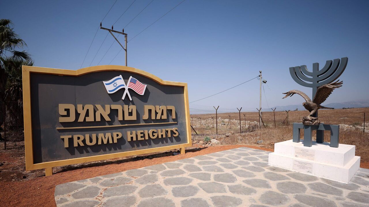1229173892 An eagle statue is seen placed on a Menorah sculpture donated by the Jewish American Society for Historic Preservation (JASHP) dedicated to US President Donald Trump by the entrance to Trump Heights, an Israeli settlement in the Israeli-occupied Golan Heights on September 21, 2020. - Twenty Jewish families are due to move to the remote spot by the end of November, with the aim of 20 families arriving each year for the next decade. Trump Heights, or "Ramat Trump" in Hebrew, was inaugurated in June 2019 by Pr