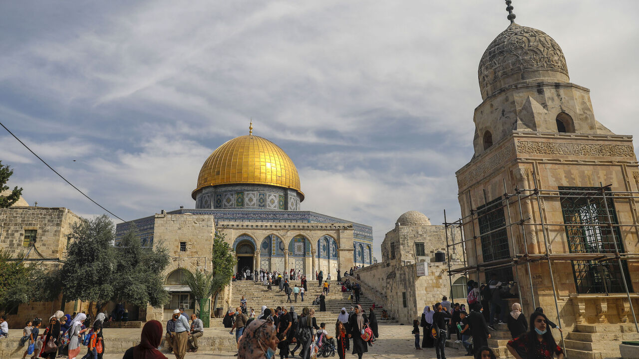 1229341220 Palestinians gather to commemorate the birth of Prophet Mohammed, known in Arabic as "al-Mawlid al-Nabawi", outside the Dome of the Rock in the al-Aqsa mosque compound, Islam's third holiest site, in the old city of Jerusalem on October 29, 2020. (Photo by AHMAD GHARABLI / AFP) (Photo by AHMAD GHARABLI/AFP via Getty Images)