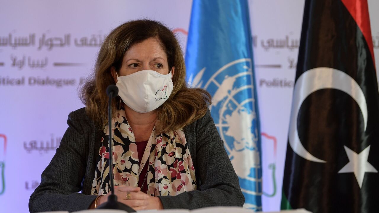 1229580623 UN acting envoy to Libya Stephanie Williams wears a protective mask before giving a press conference in the Tunisian capital Tunis on November 11, 2020, following 2 days of talks, hosted by the UN on the Libyan conflict. - The delegates "reached a preliminary roadmap for ending the transitional period and organising free, fair, inclusive and credible presidential and parliamentary elections," Williams told journalists.
After years of conflict sparked by a 2011 NATO-backed uprising, Libya has two rival admi