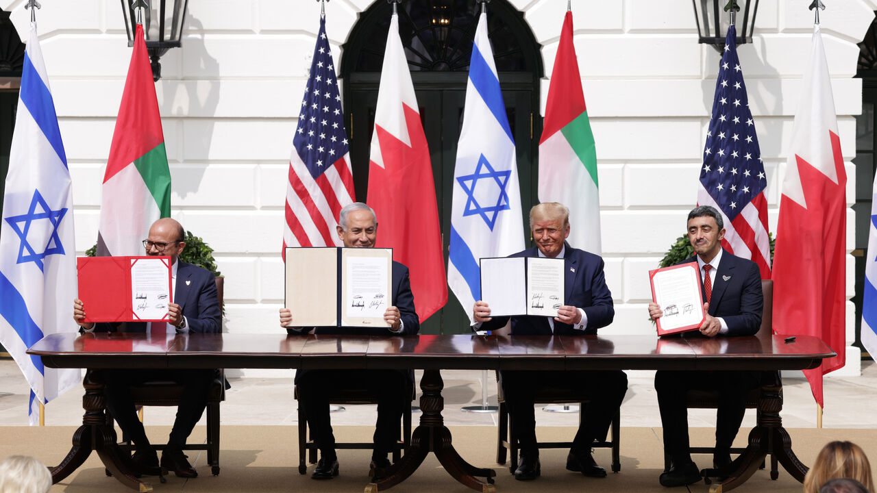 1272675620 WASHINGTON, DC - SEPTEMBER 15: (L-R) Foreign Affairs Minister of Bahrain Abdullatif bin Rashid Al Zayani, Prime Minister of Israel Benjamin Netanyahu, U.S. President Donald Trump, and Foreign Affairs Minister of the United Arab Emirates Abdullah bin Zayed bin Sultan Al Nahyan participate in the signing ceremony of the Abraham Accords on the South Lawn of the White House on September 15, 2020 in Washington, DC. Witnessed by President Trump, Prime Minister Netanyahu signed a peace deal with the UAE and a decl
