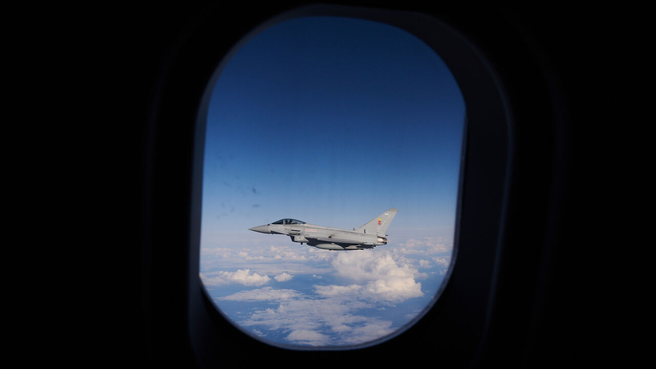 1279145542 IN FLIGHT, SCOTLAND - OCTOBER 08: An RAF Typhoon combat aircraft departs after refueling from an RAF Voyager aircraft over the North Sea on October 08, 2020 in flight, above Scotland. The first air-to-air refuelling of F-35Bs from the newly-formed Carrier Strike Group took place as part of Operation Joint Warrior. Flying from HMS Queen Elizabeth, the RAF, RN and USMC Pilots (USofA) were demonstrating the operational capabilities of NATO and the UK for current and future threats. Operation Joint Warrior took