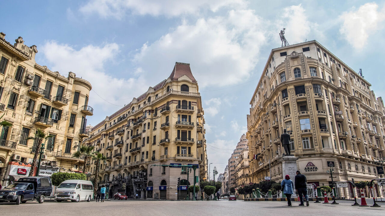 1134337073 TOPSHOT - This picture taken on March 8, 2019 shows a view of the central Talaat Harb square in the Egyptian capital Cairo's downtown district. - Cairo's unique downtown district, with its elegant centuries-old, European-designed buildings, is wrestling to preserve its cultural heritage as the government prepares to move offices to a new desert capital. (Photo by Khaled DESOUKI / AFP) (Photo credit should read KHALED DESOUKI/AFP via Getty Images)