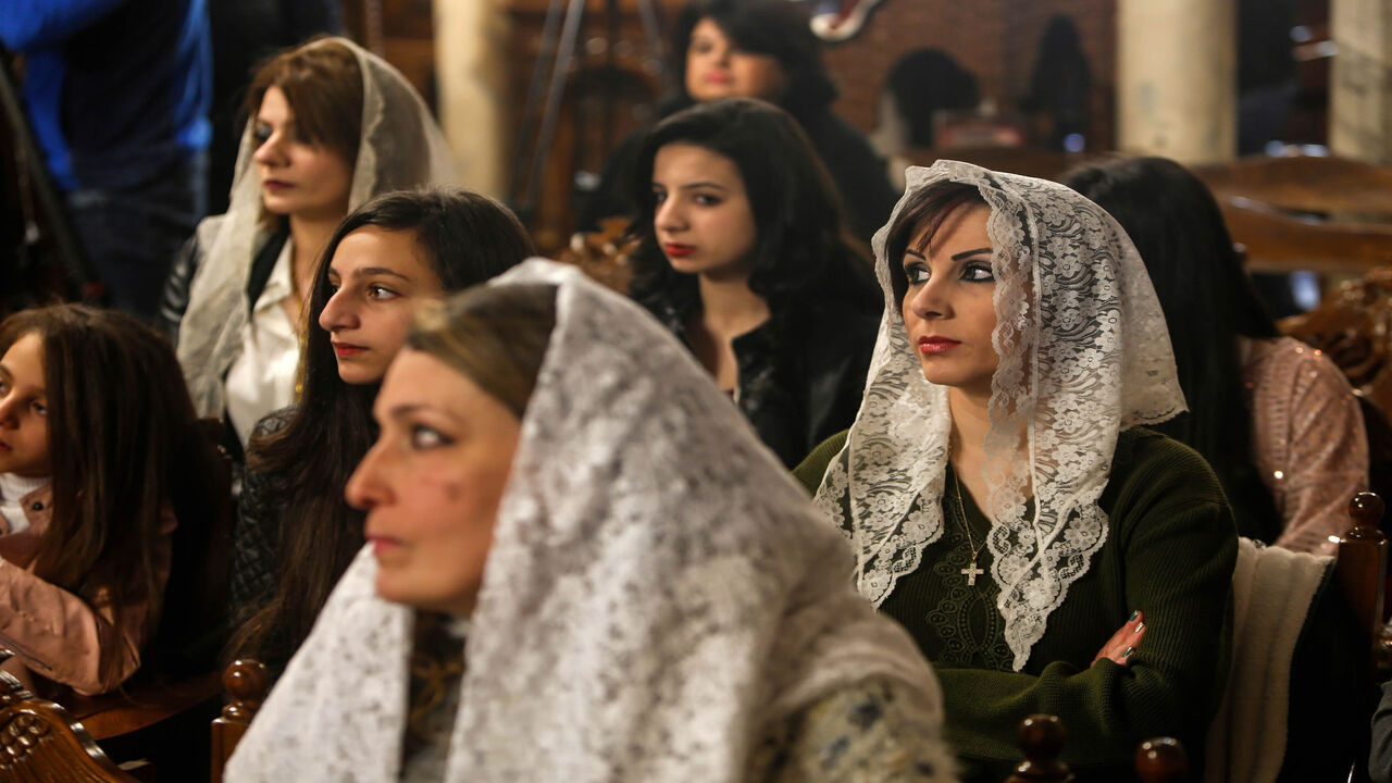 1192350276 Palestinian Orthodox Christians attend a Christmas Mass at the Church of Saint Porphyrius in Gaza City on January 7, 2020. (Photo by MOHAMMED ABED / AFP) (Photo by MOHAMMED ABED/AFP via Getty Images)