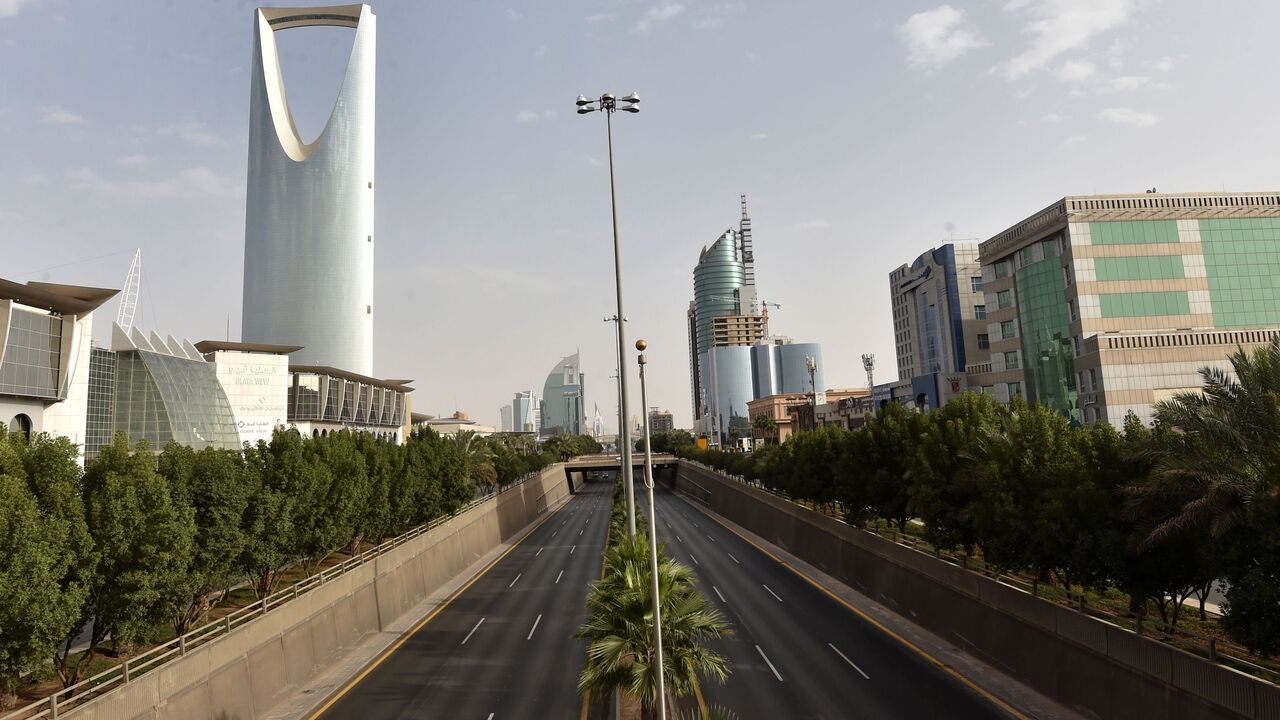1208283548 A picture taken on March 26, 2020, shows the main King Fahd road empty in the Saudi capital Riyadh, after the Kingdom began implementing an 11-hour nationwide curfew, on the day of an emergency G20 videoconference, to discuss a response to the COVID-19 crisis. - G20 nations pledged a "united front" Thursday in the fight against coronavirus, saying they were injecting $5 trillion into the global economy to counter the pandemic amid forecasts of a deep recession. US President Donald Trump and Russian Presiden